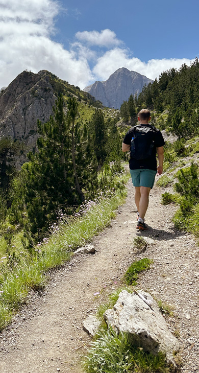 Man walking on mountain path