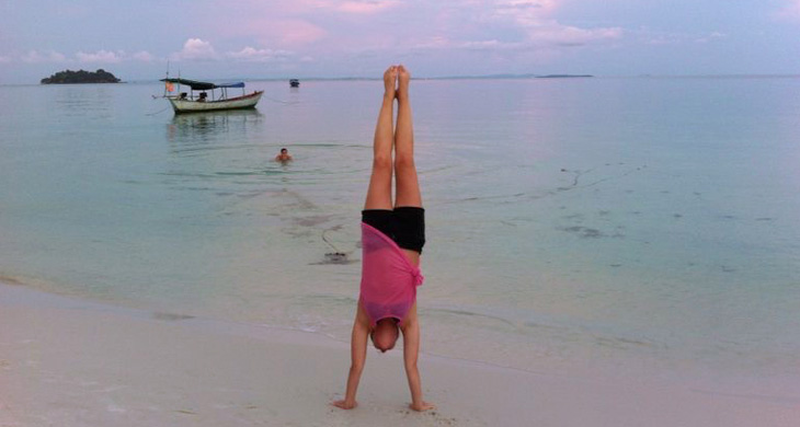 handstand on beach
